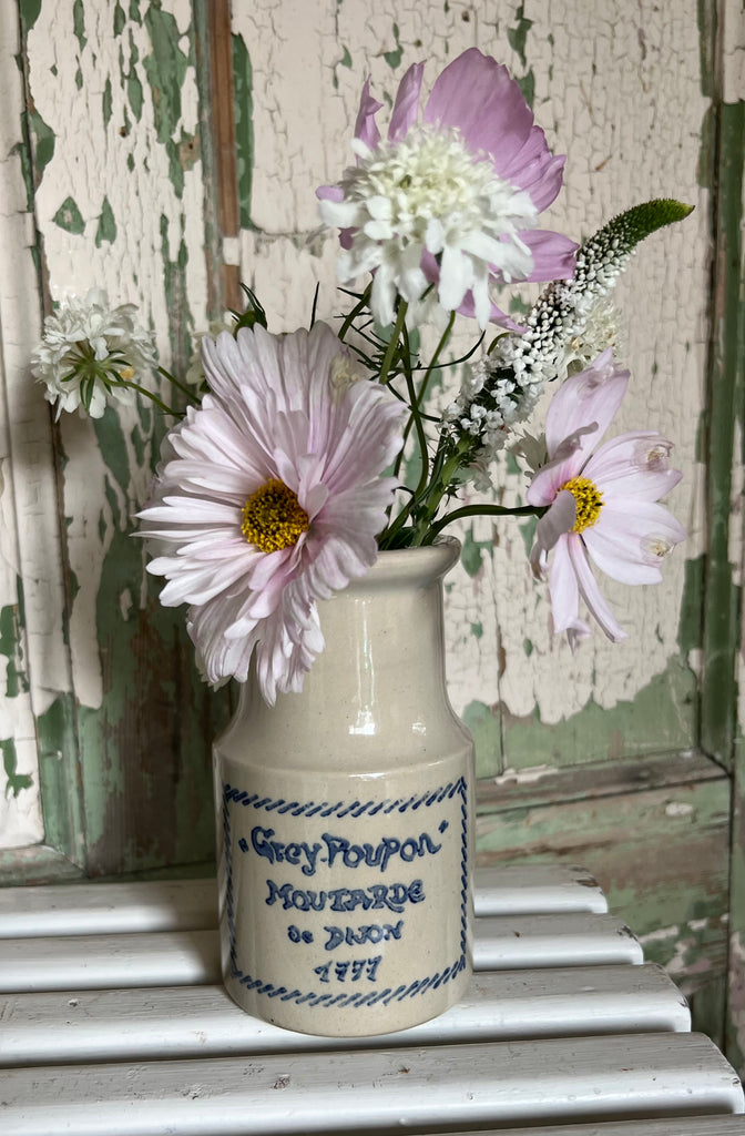 Grey Poupon mustard jar