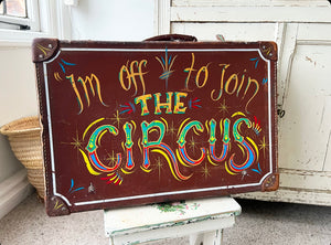 Vintage sign written circus suitcase